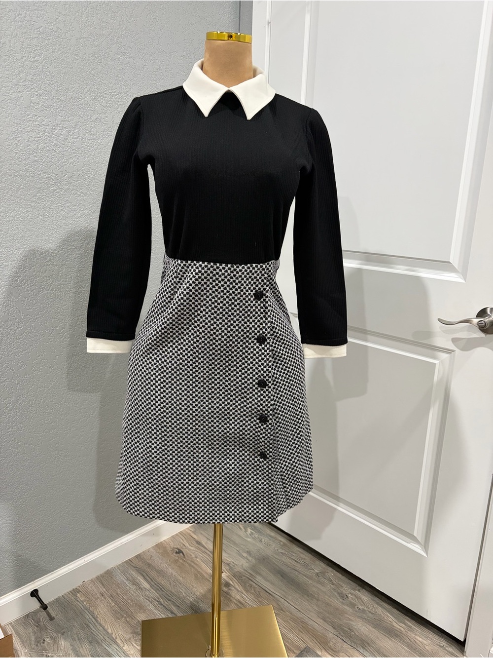 Classic Black Long-Sleeve Dress with White Collar and Patterned Skirt